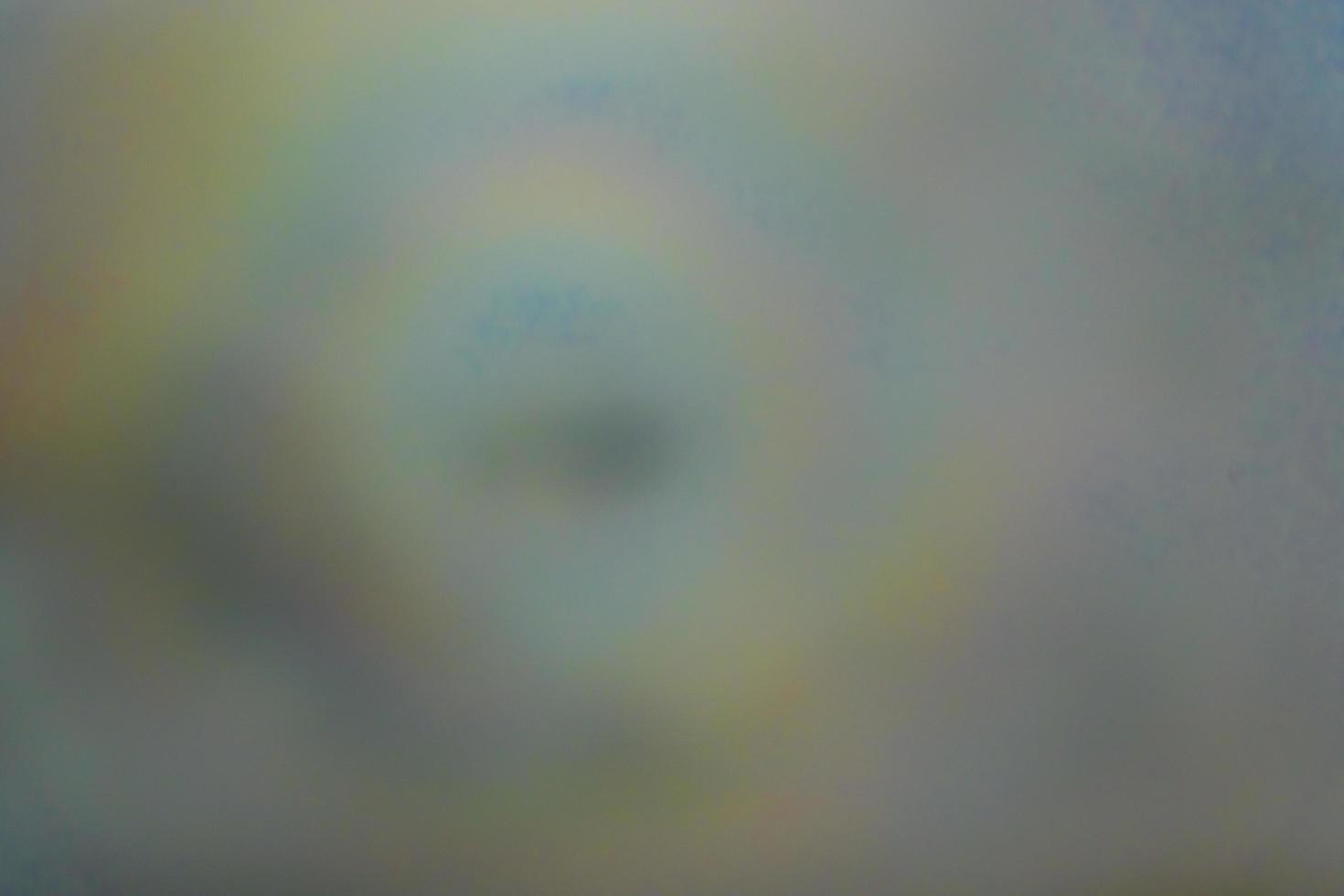 blurry shadow of the airplane on the cloud with the rainbow circle. traveling concept photo