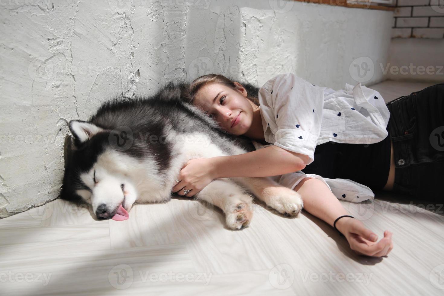 Girl Pet owner hugging with dog puppy. Happy Human female and cute funny dog lying on floor together 9210001 Stock Photo at Vecteezy Girl Pet owner hugging with dog puppy. Happy Human female and cute funny dog lying on floor together 9210001 Stock Photo at Vecteezy