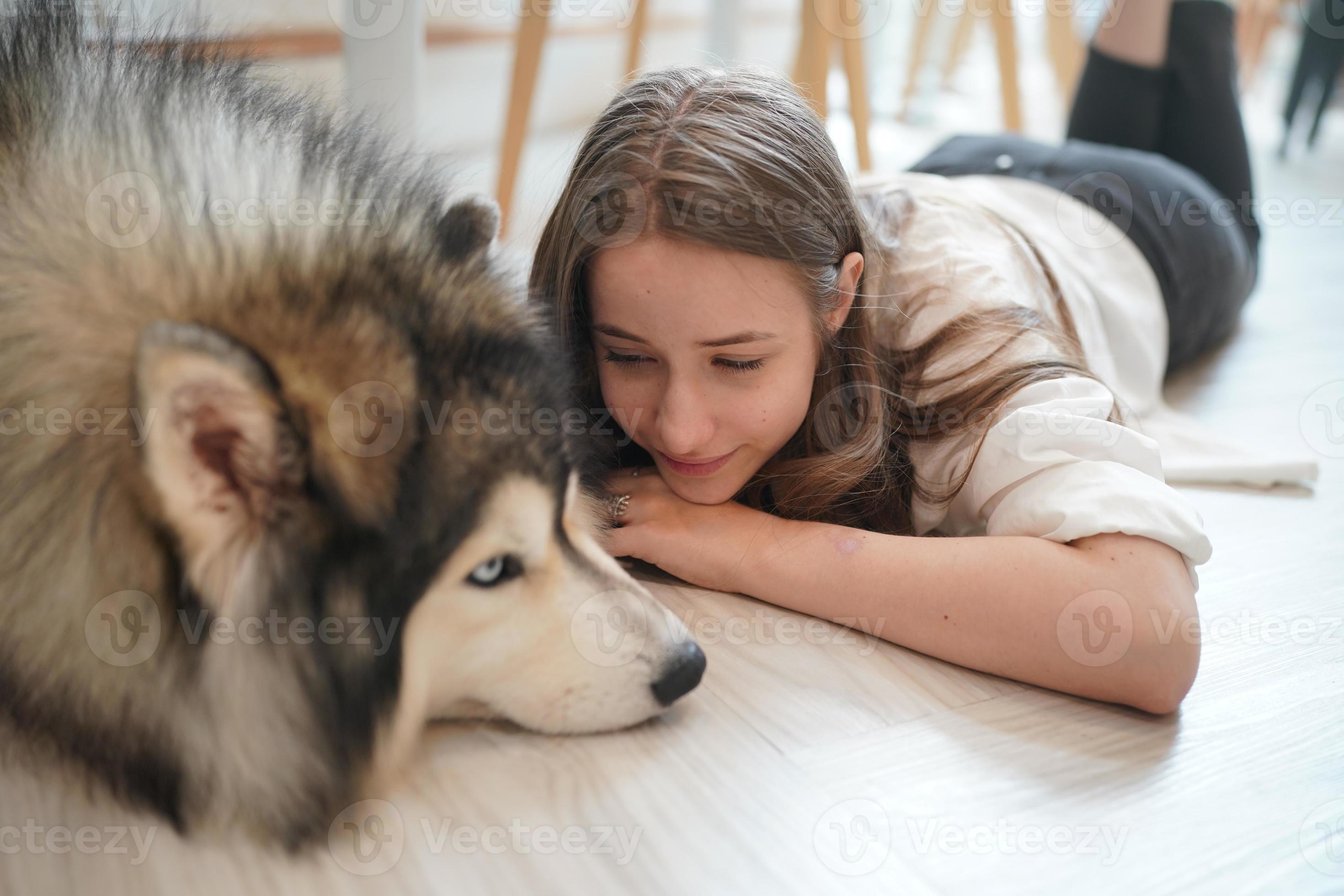 Girl Pet owner hugging with dog puppy. Happy Human female and cute ...