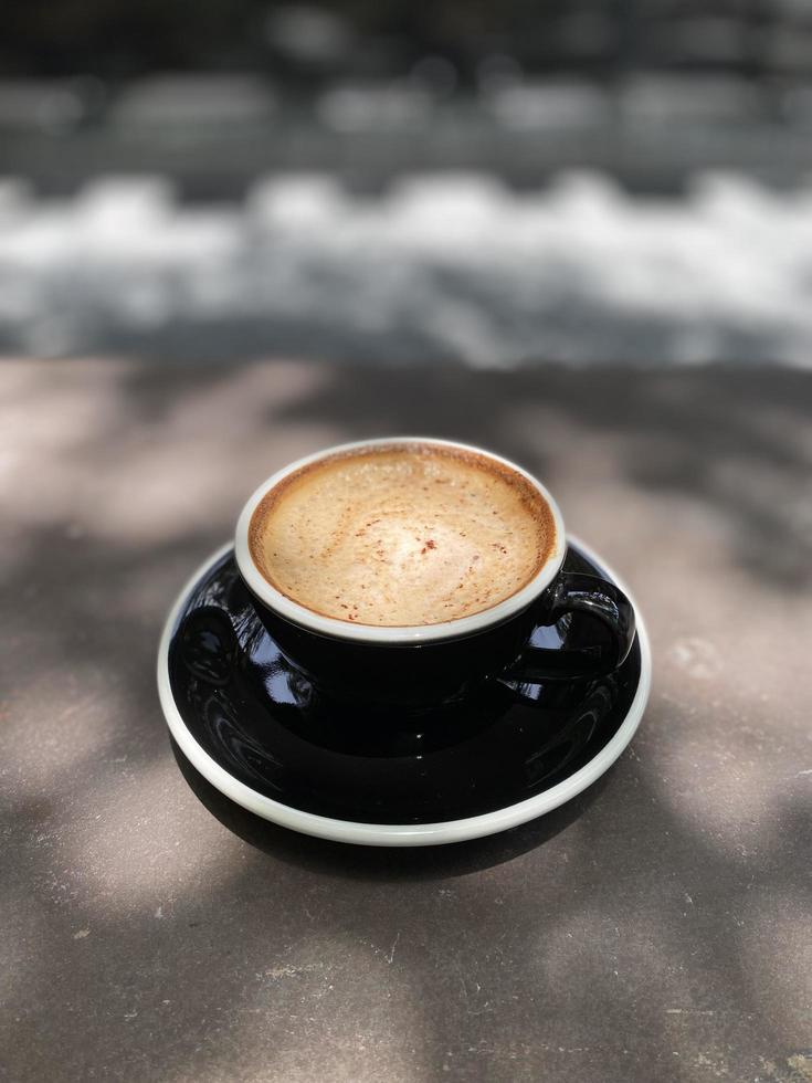 Hot coffee cup on table photo