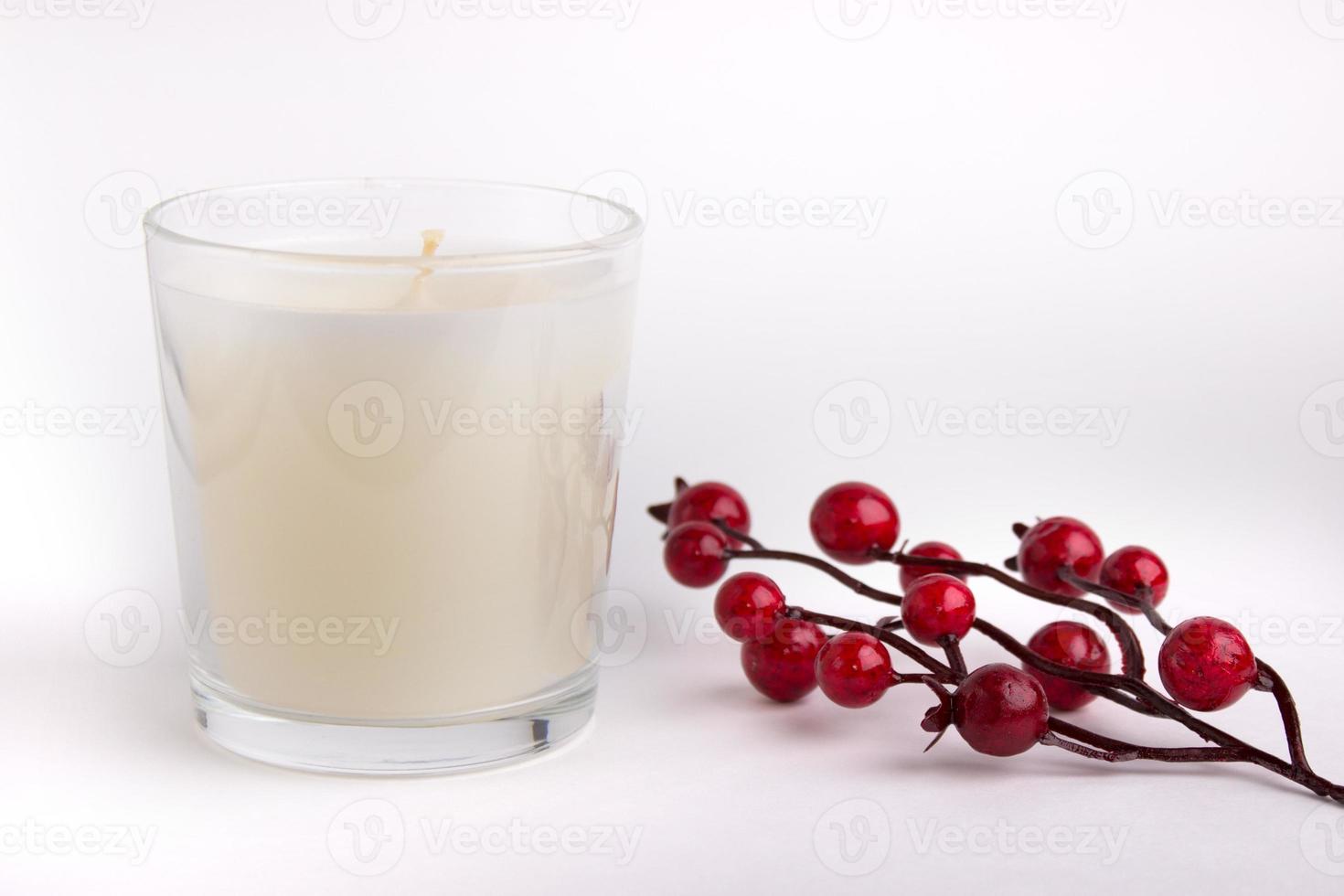Candle in glass on white background with red berries, product mockup photo