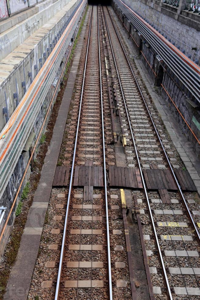 A road with rail tracks intended for the movement of railway rolling stock. photo