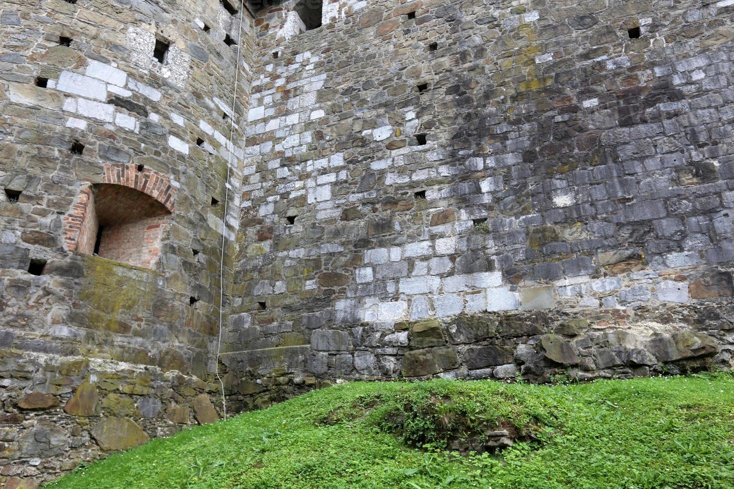 Stone wall of ancient Crusader fortress photo