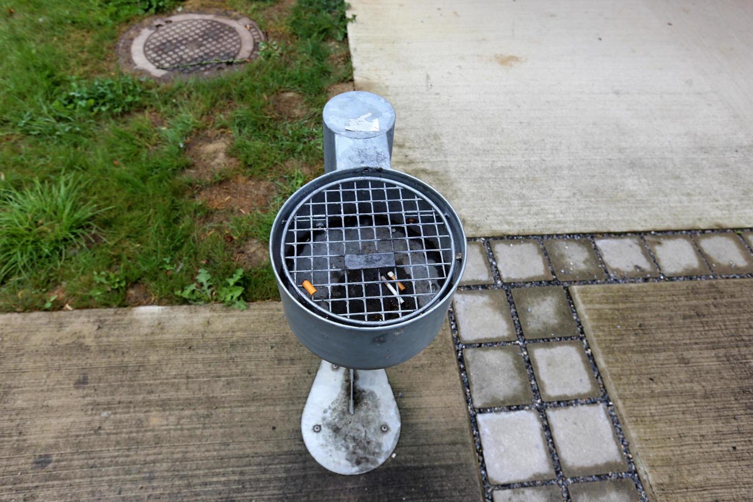 Ashtray - a container for tobacco ash, cigarette butts, cigars. photo