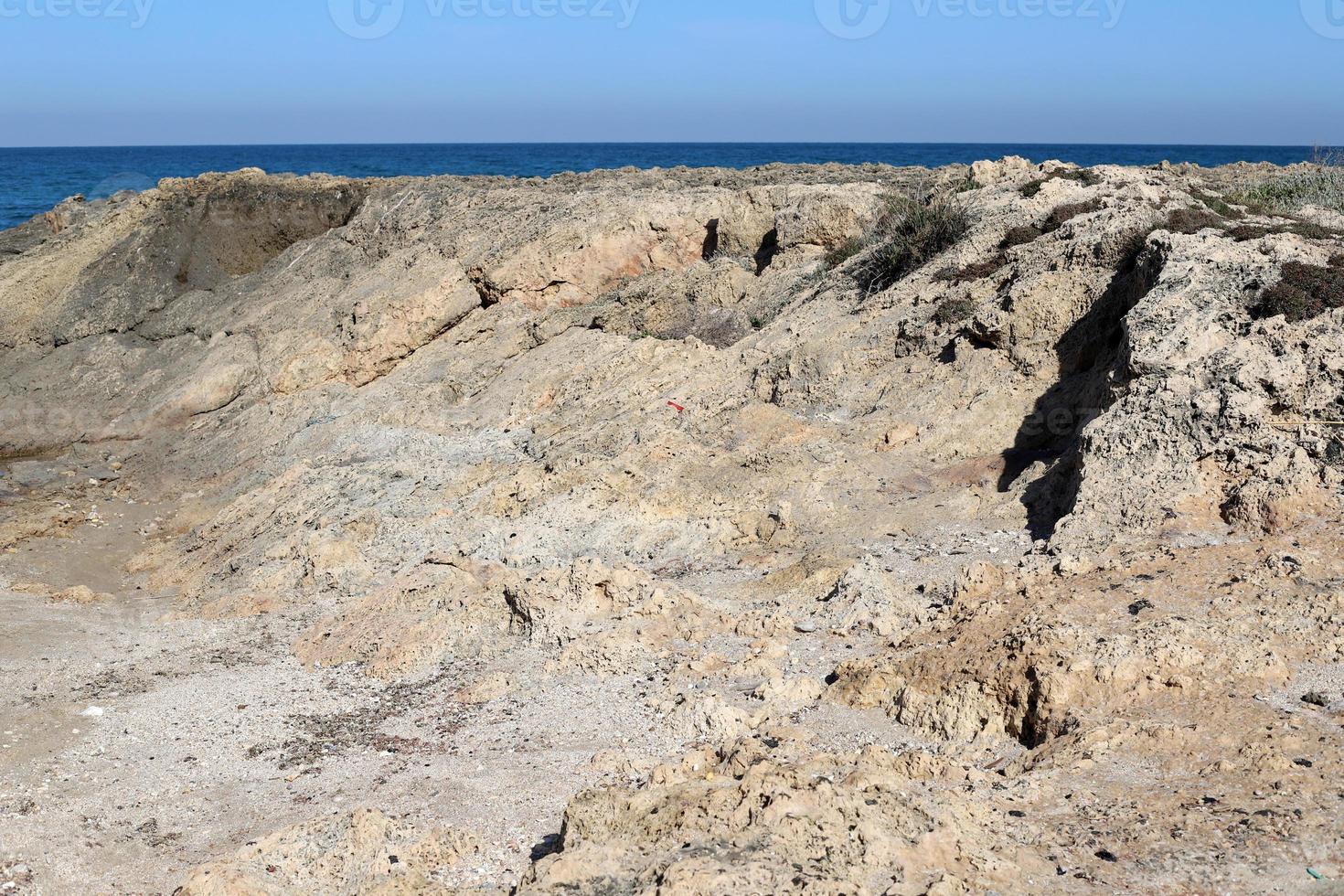 High cliffs on the shores of the Mediterranean Sea photo