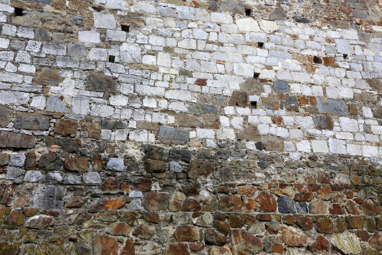 Stone wall of ancient Crusader fortress photo