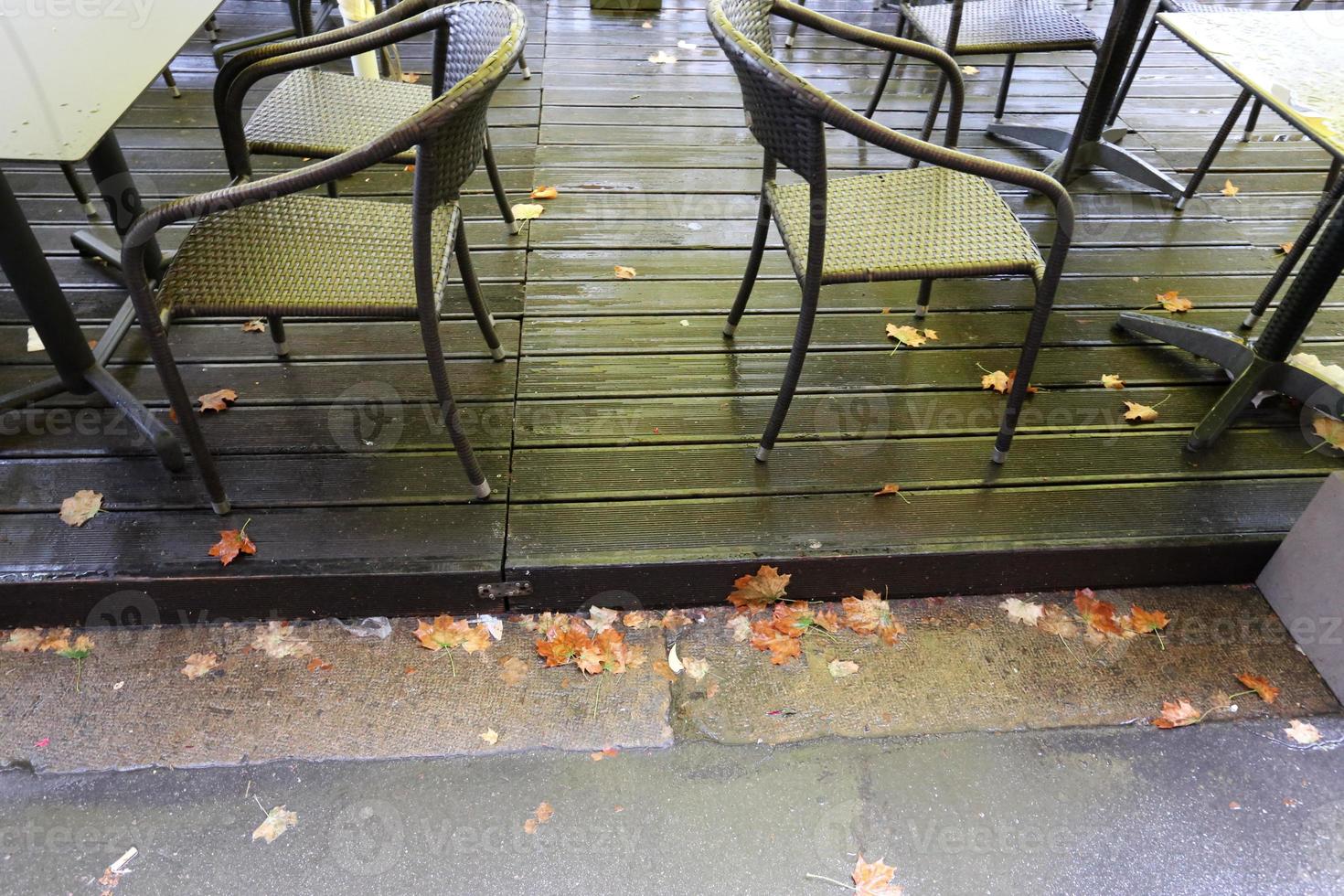 Table and chairs in a cafe in a city park photo