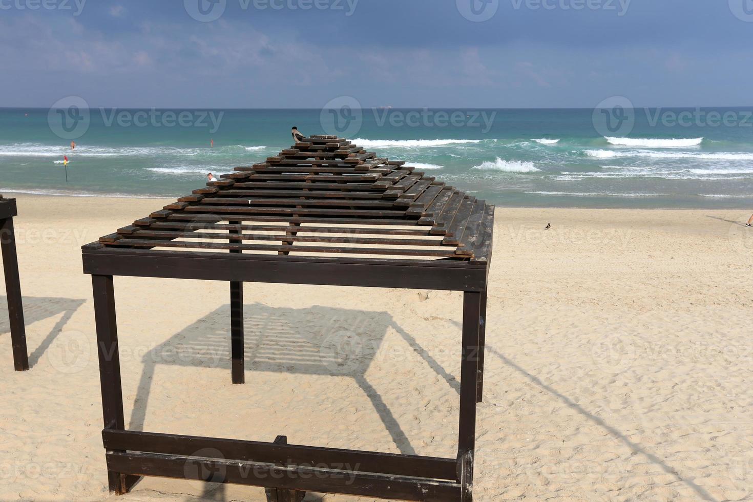 Canopy from the sun on the city beach photo
