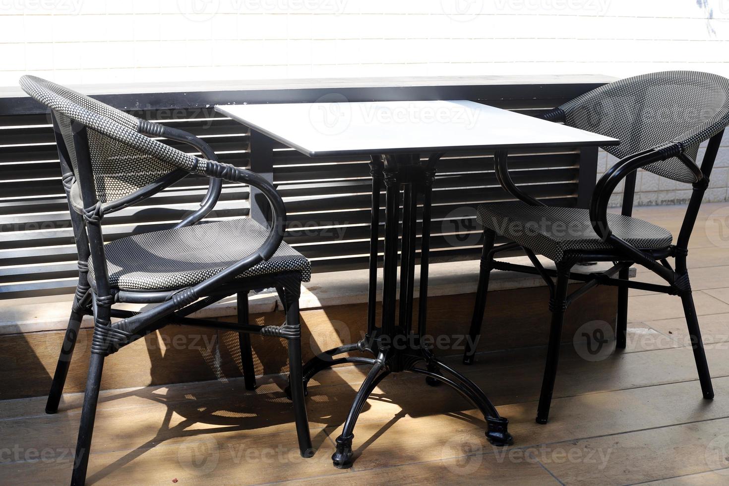 Chair and table in a cafe on the Mediterranean coast photo