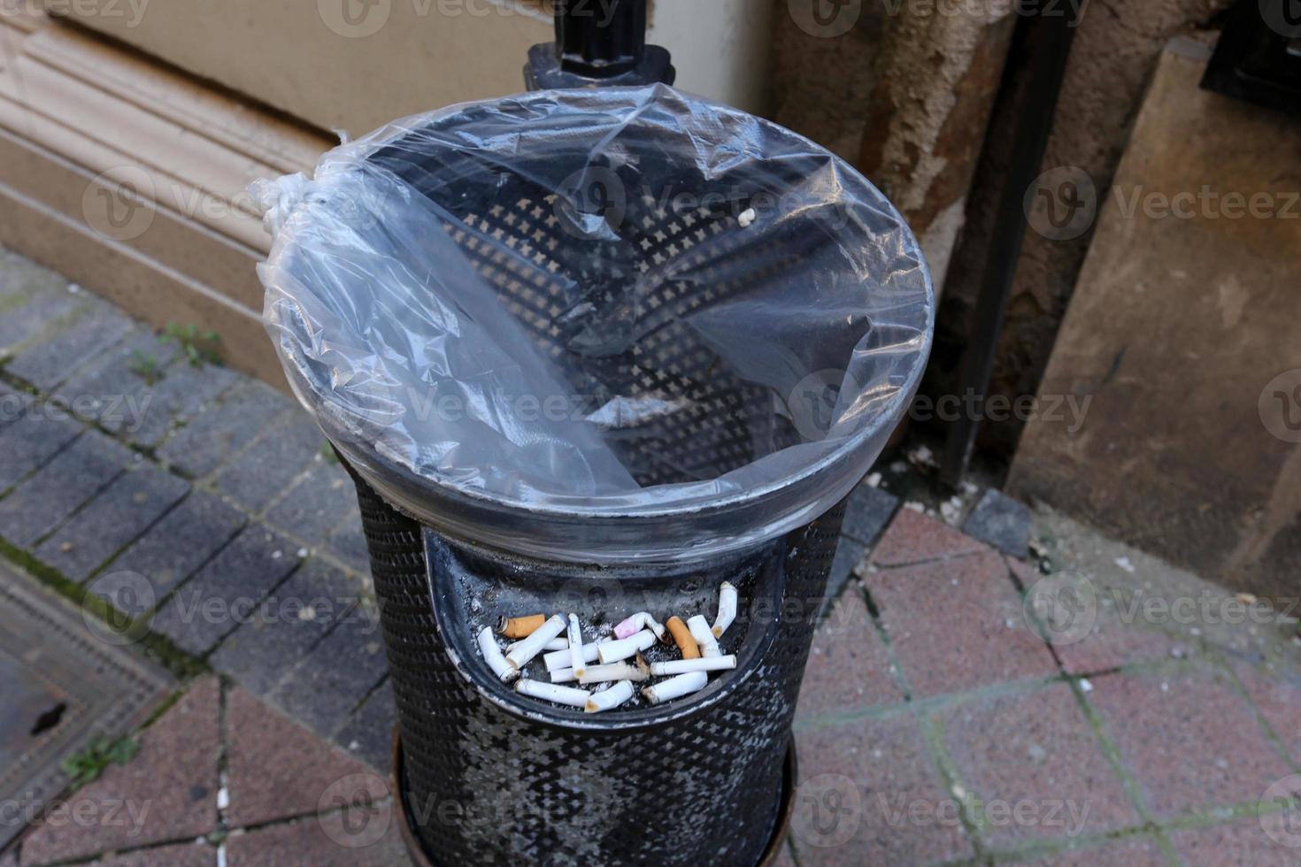 Ashtray - a container for tobacco ash, cigarette butts, cigars. photo