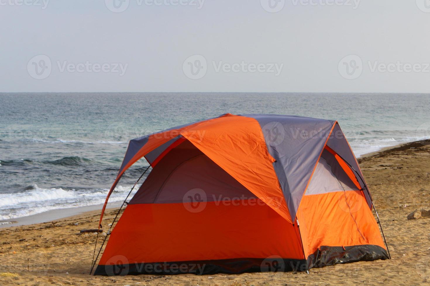 Tourist tent on the Mediterranean coast. photo