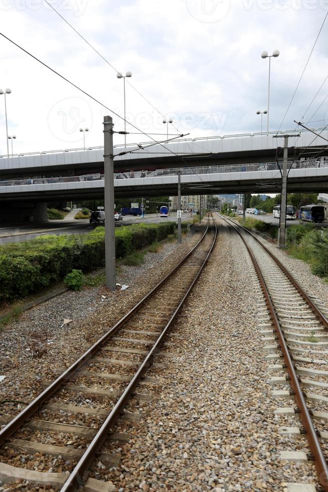 A road with rail tracks intended for the movement of railway rolling stock. photo