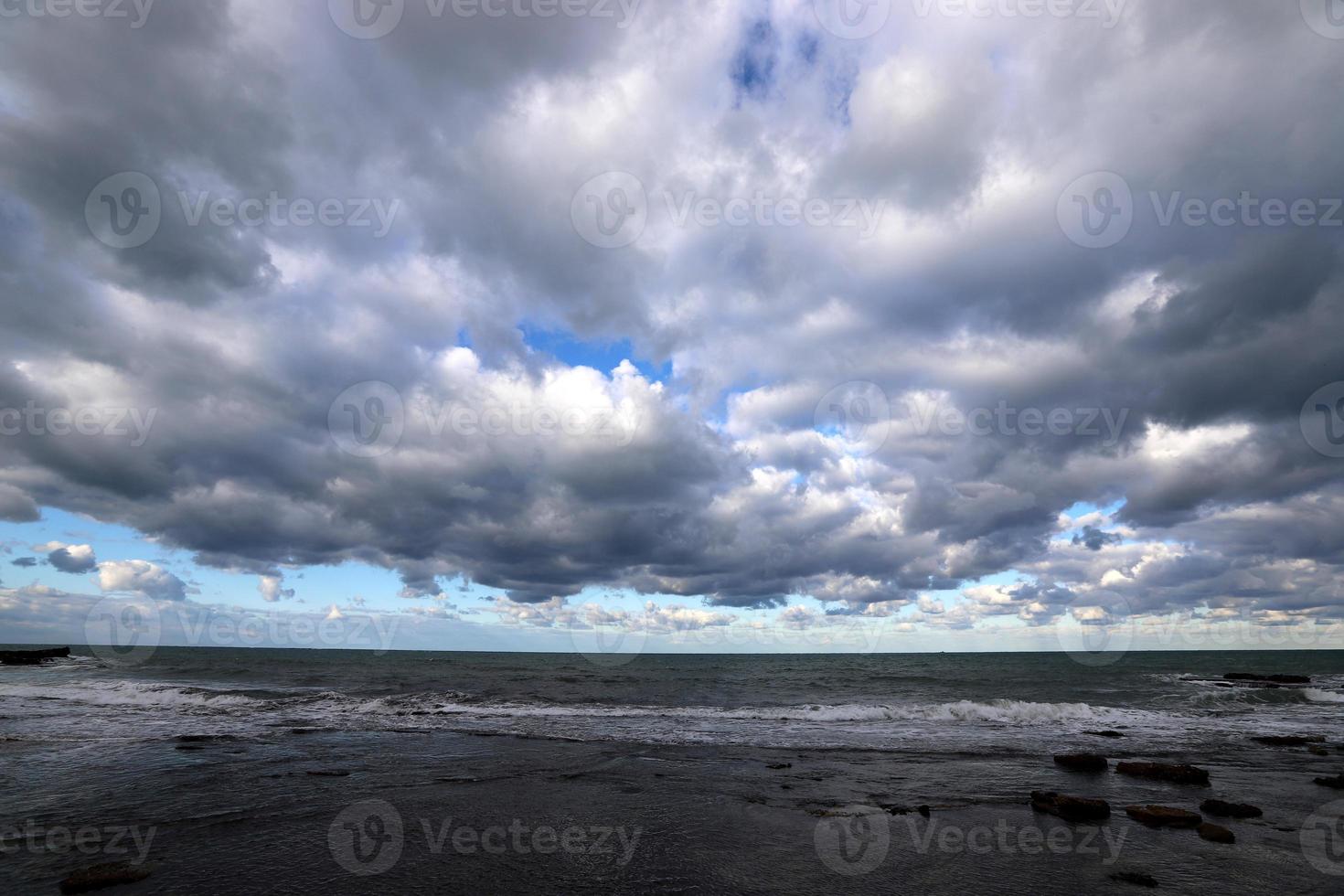 Thunderclouds in the sky over the mediterranean sea photo