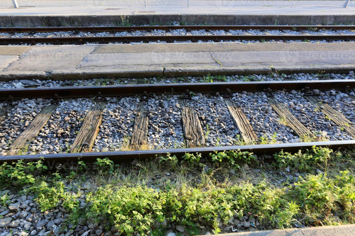 A road with rail tracks intended for the movement of railway rolling stock. photo