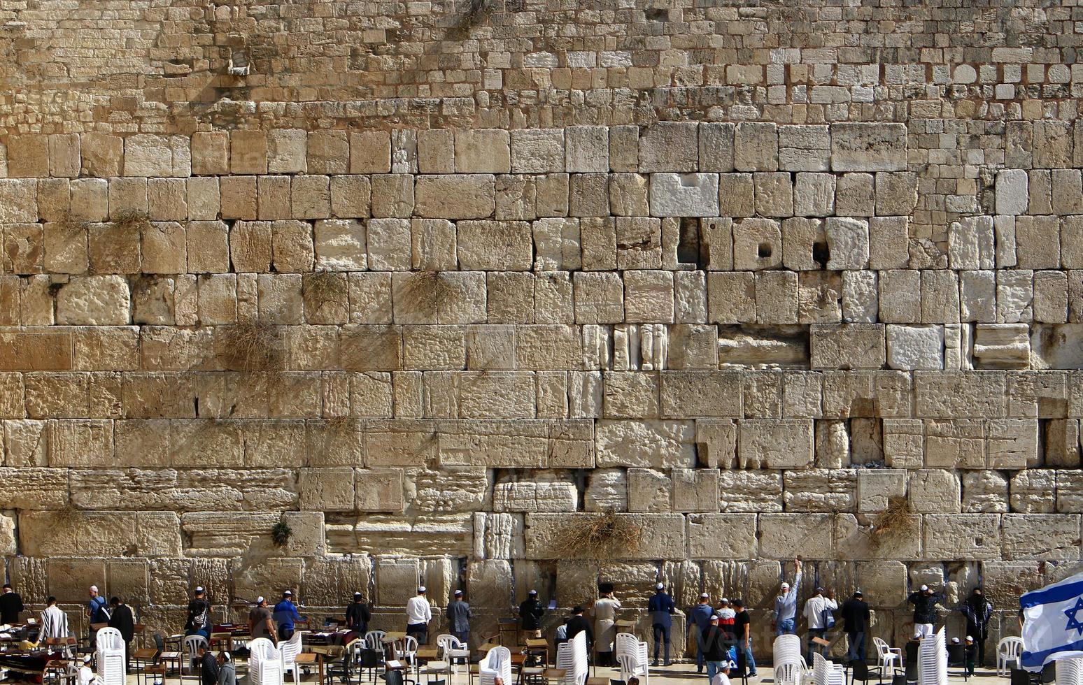 Notes in the Wailing Wall in Jerusalem with their requests and desires addressed to God. photo