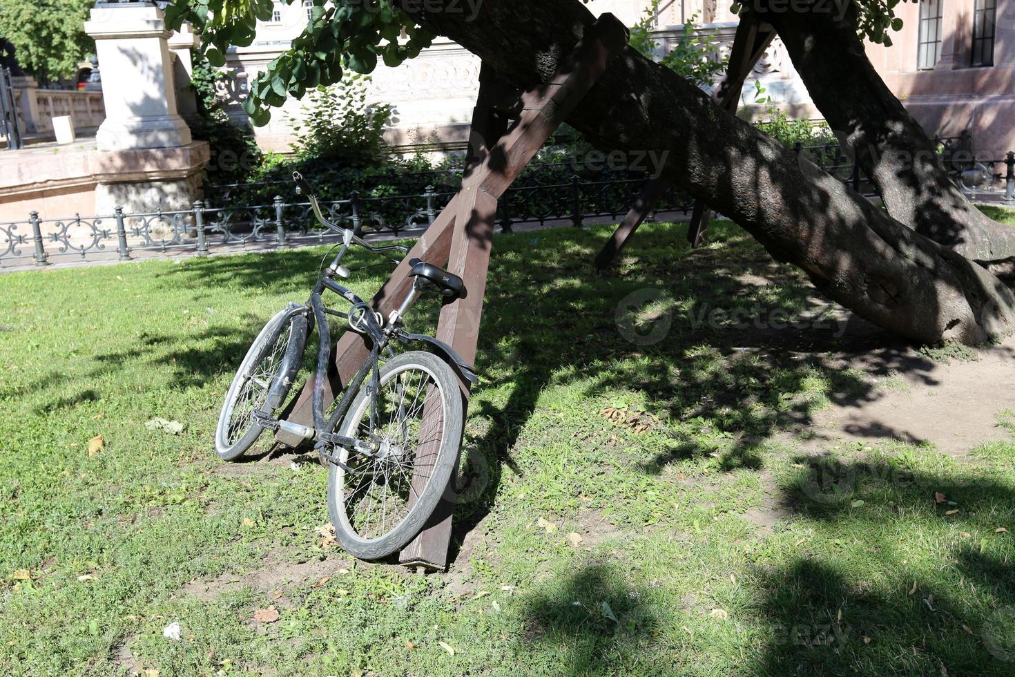 Bicycle stands on the street in a big city photo