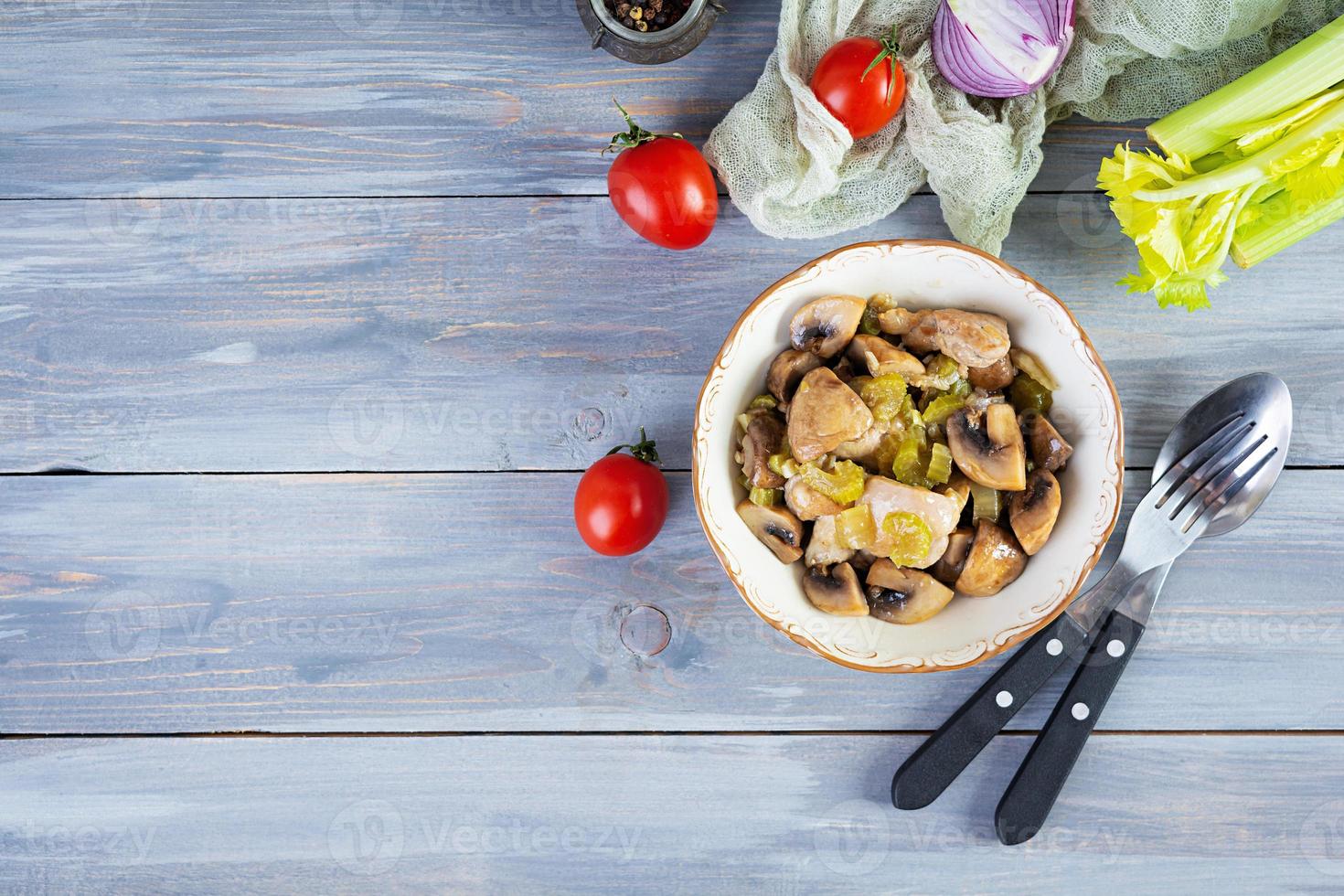 Stew chicken thighs with mushrooms, celery, onion and pepper. Stir fry