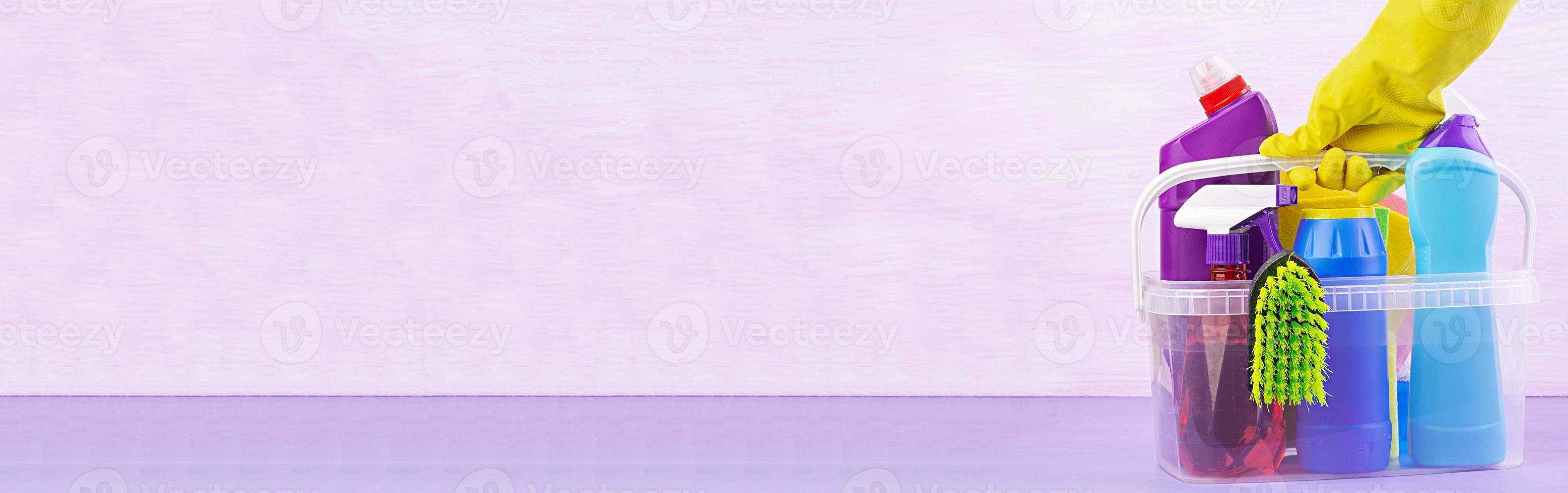 Cleaning service concept. Colorful cleaning set for different surfaces in kitchen, bathroom and other rooms. Banner photo
