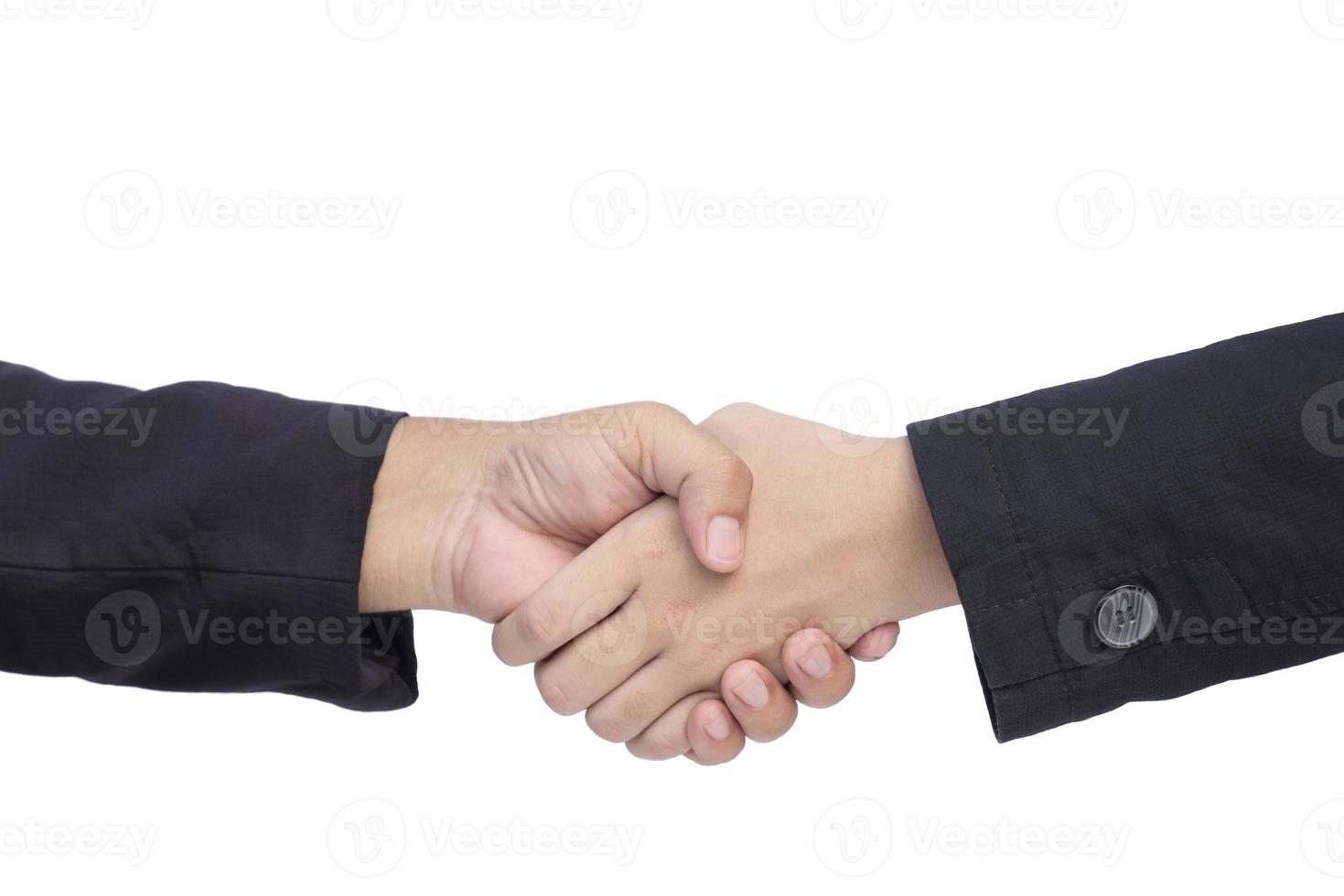 Close up mature and young businessmen are shaking hands on isolated white background photo