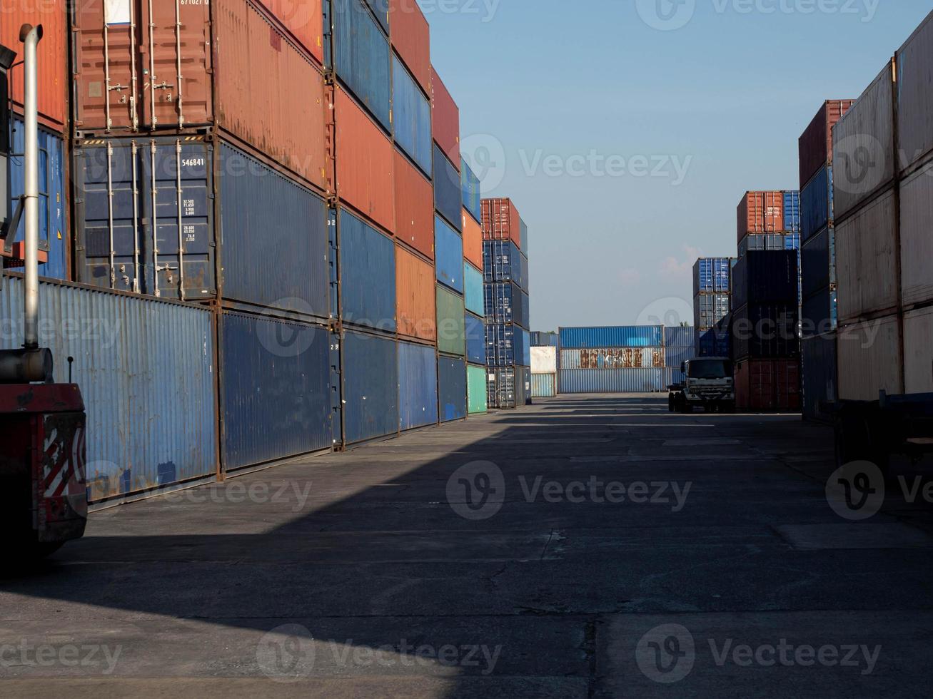 Terminal warehouse mortgage cargo container orange color forklift custom trade engineer technology transportation company factory logistic ecommerce international import export.Sky blue cloud white photo