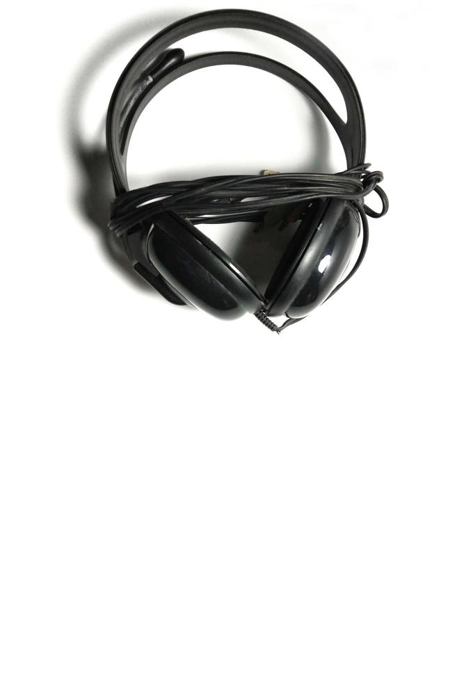 Black headphones with white background copy space give the concept of modern technological developments. photo