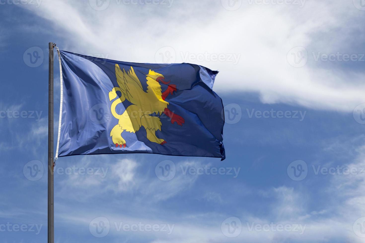 Flag of Saint Brieuc waving in mid air photo