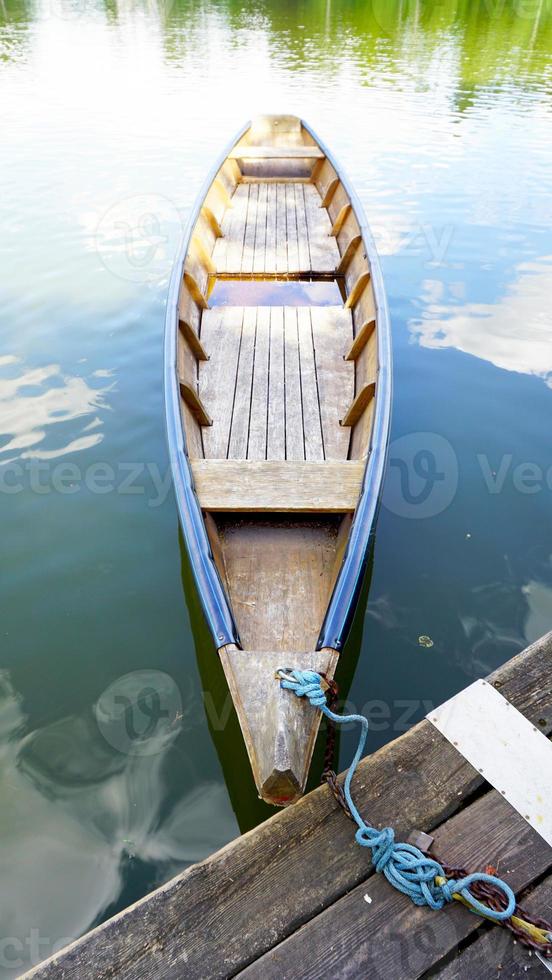 Wood boat in the lake photo