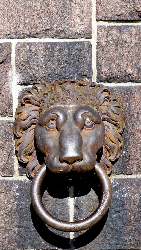 lion door handle at cityhall in stockholm photo