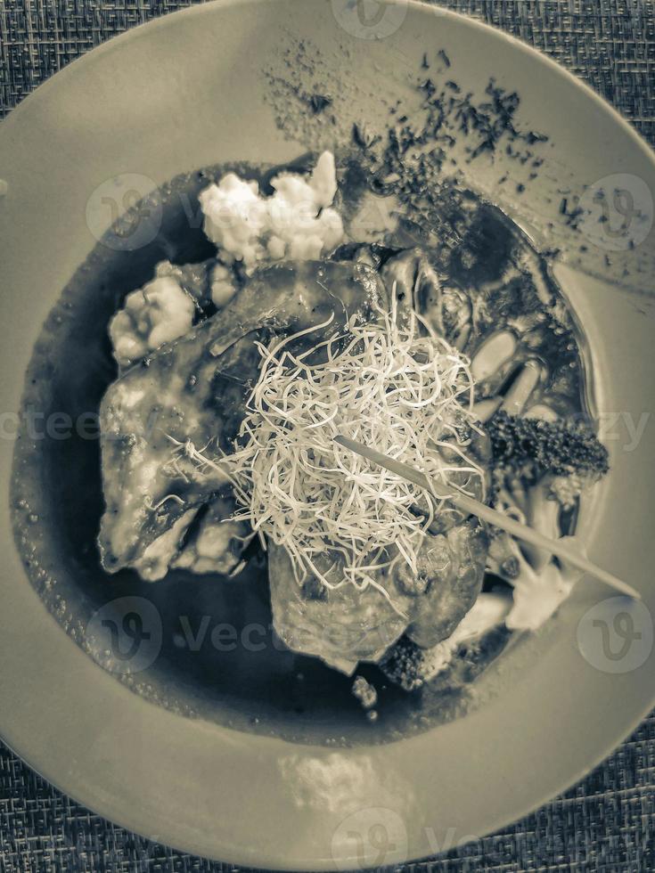 Plate of food in restaurant PapaCharly Playa del Carmen Mexico. photo