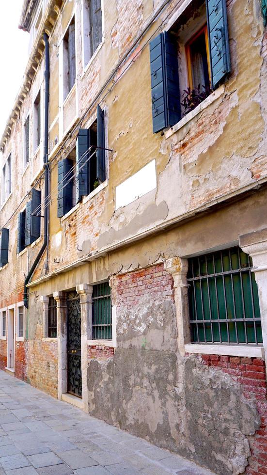 Alley with old building in Venice, Italy photo