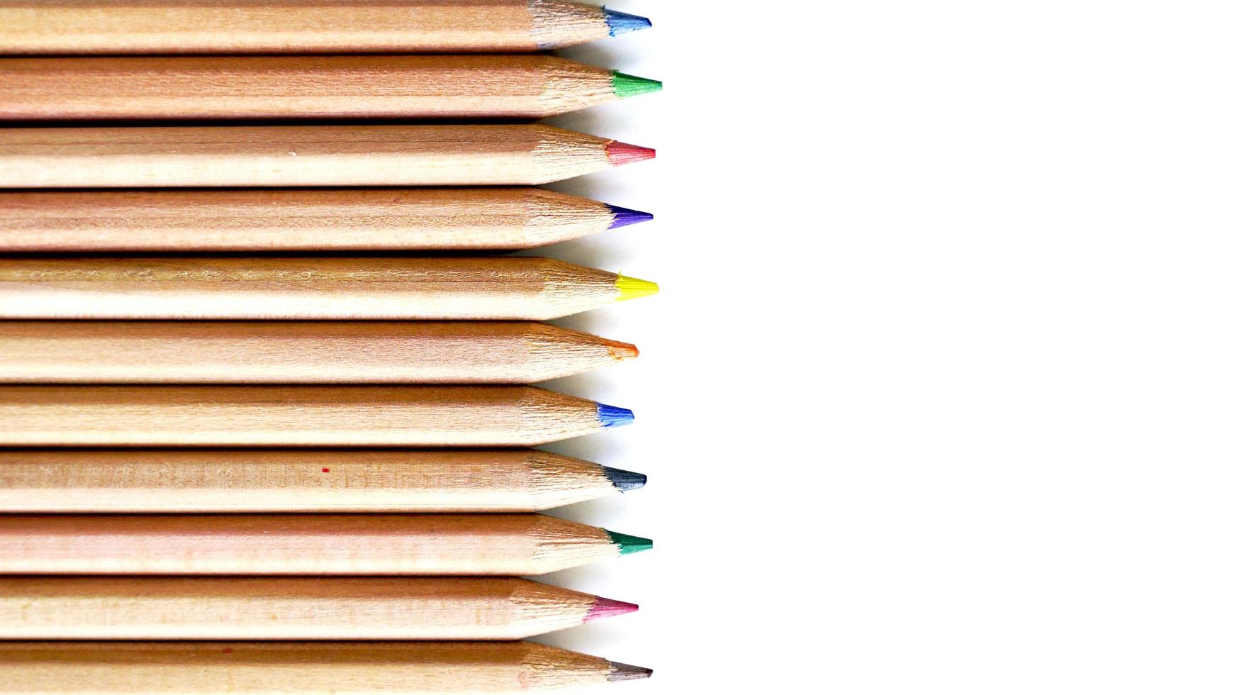 Wooden Color pencils arrangement top view isolated photo