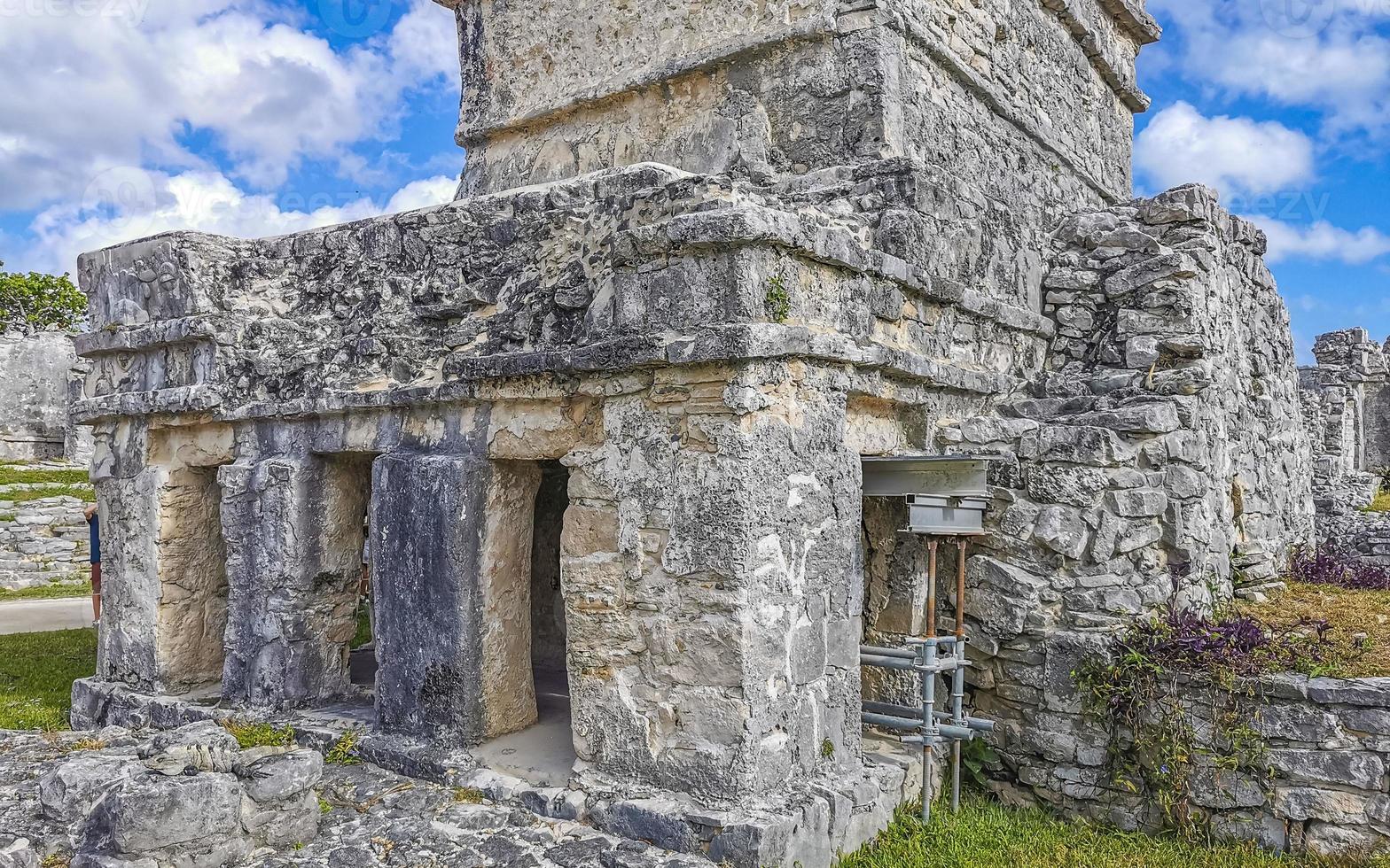 Ancient Tulum ruins Mayan site temple pyramids artifacts seascape Mexico. photo