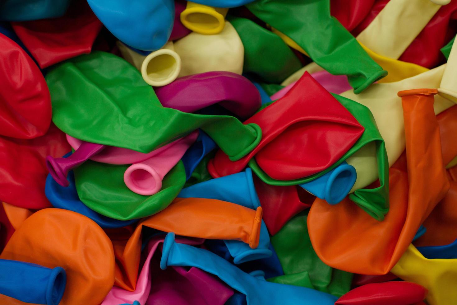 Colorful balloons and confetti on blue table top view. Festive or party background. Flat lay style. Copy space for text. Birthday greeting card.Selective focus. photo