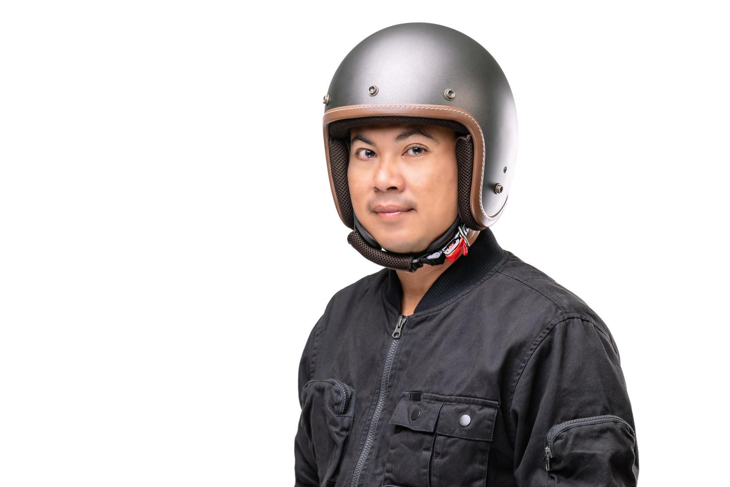 Motorcyclist or rider wearing vintage helmet. Safe ride concept. Studio shot isolated on white photo