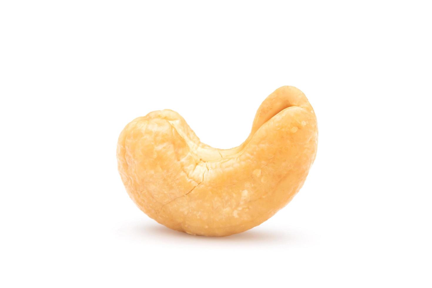 Pile of roasted cashew nut isolated on white background. Food concept photo