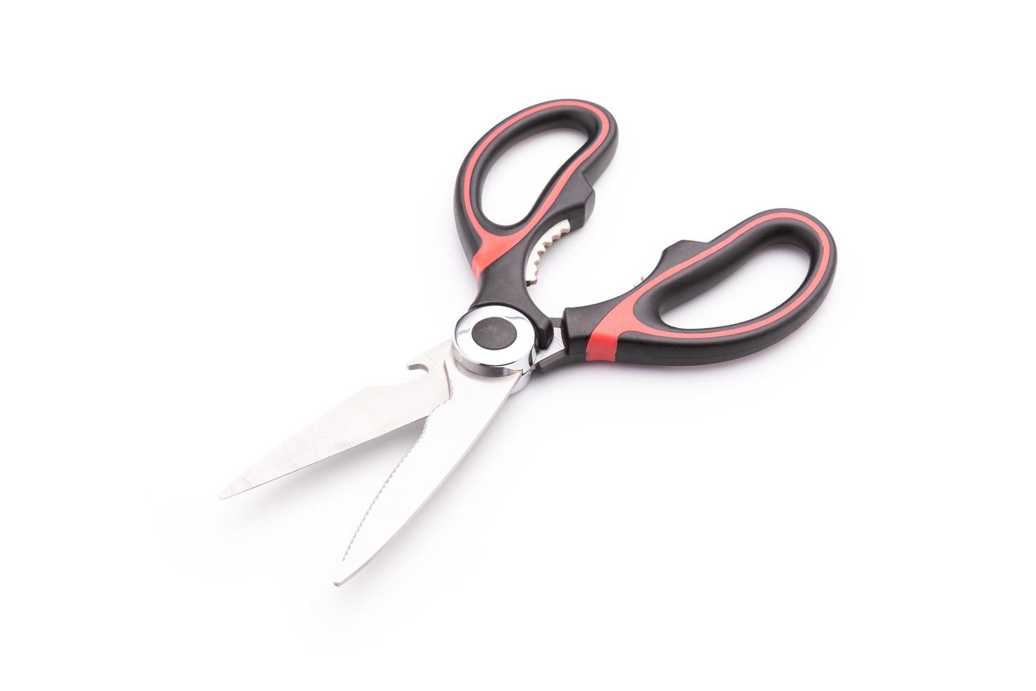 New scissor with red and black color on handle isolated on white photo