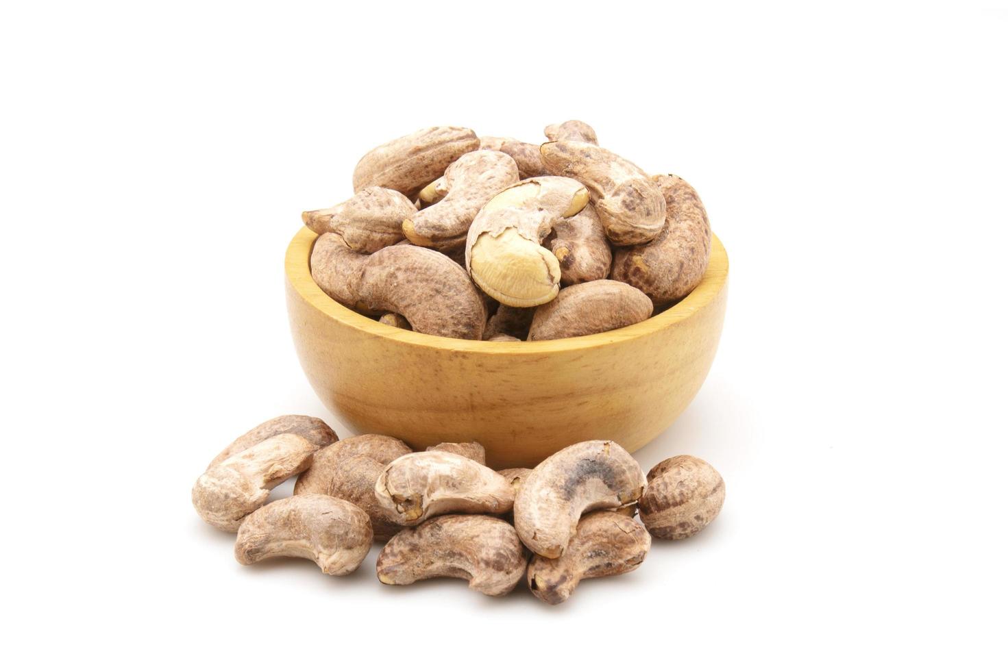 Pile of roasted cashew nut isolated on white background. Food concept photo