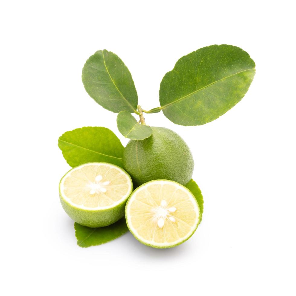 Slice of Thai Lime -Common Lime or local lime isolated on white background. Food and healthcare concept photo