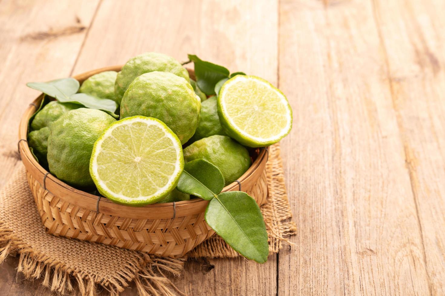 Slice of Thai bergamot on wooden table background. Food and healthcare concept photo