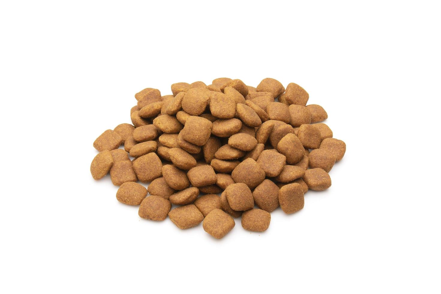 Pile of dog food isolated on white photo