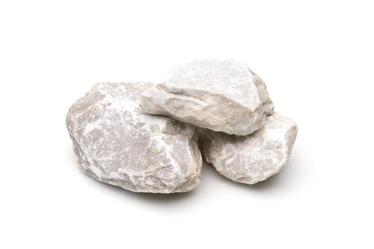Conjunto blanco de piedras de roca de granito aislado sobre fondo blanco. foto