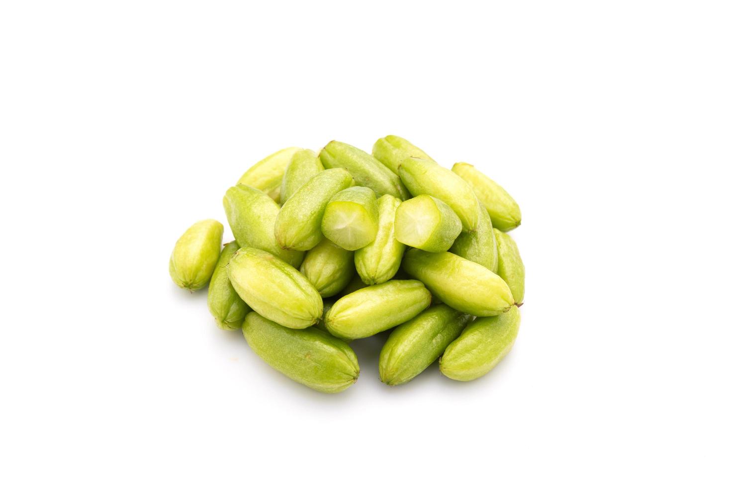 Bilimbi or Averrhoa bilimbi isolated on white background. Food and healthcare concept photo