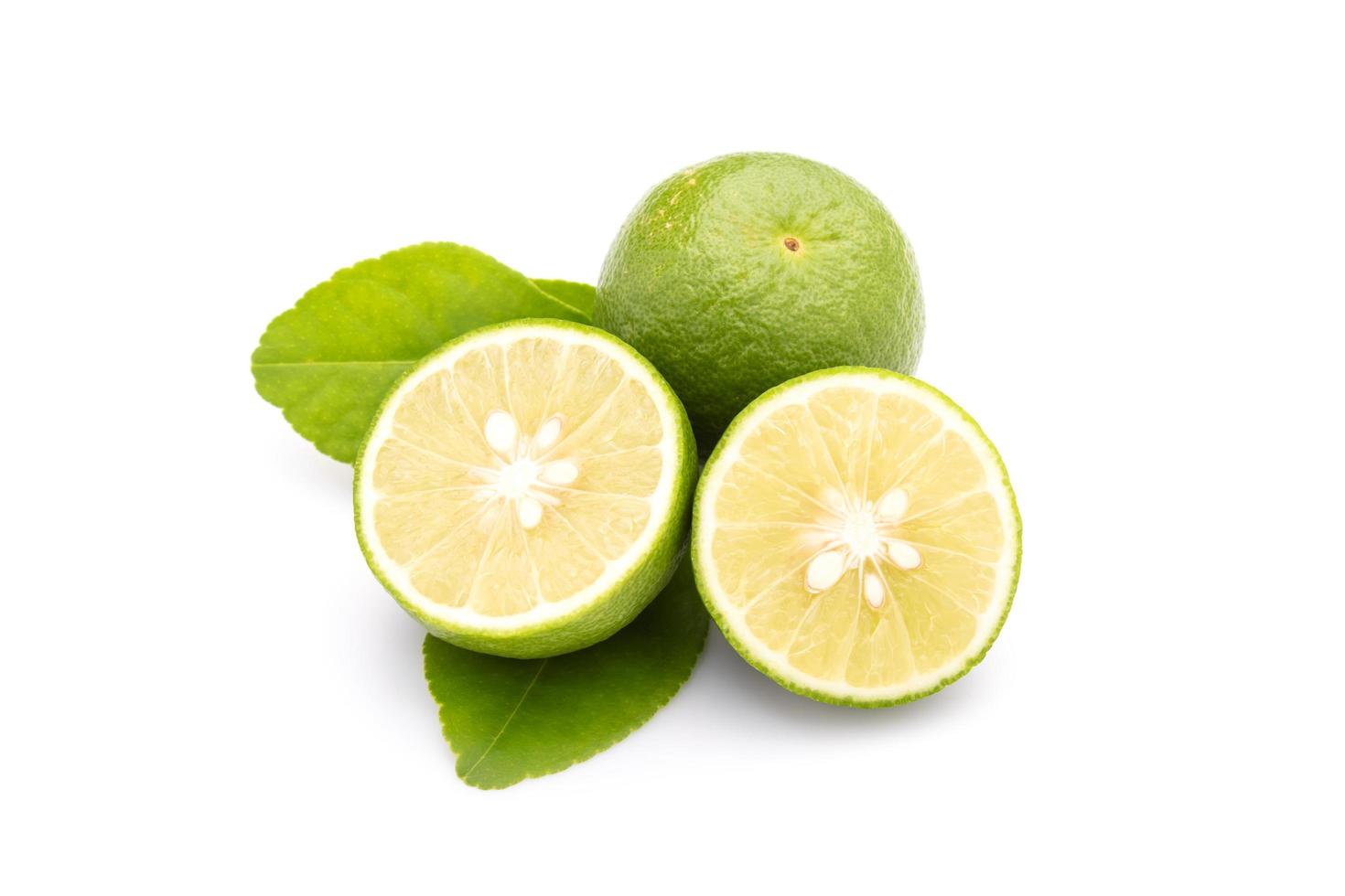 Slice of Thai Lime Common Lime or local lime isolated on white background. Food and healthcare concept photo