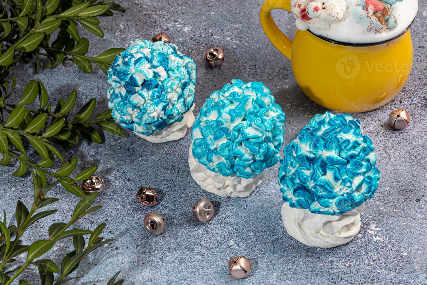Handmade marshmallows on a light background in the form of roses, hydrangeas and tulips. There are flowers nearby. Women's day, Valentine's day. photo