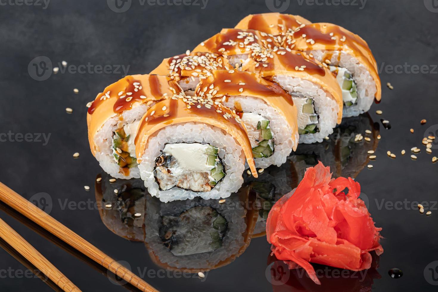 Sushi sets Uramaki, California, Philadelphia, rolls on a white plate. Menu for restaurants, cafes. On a dark reflective background. photo