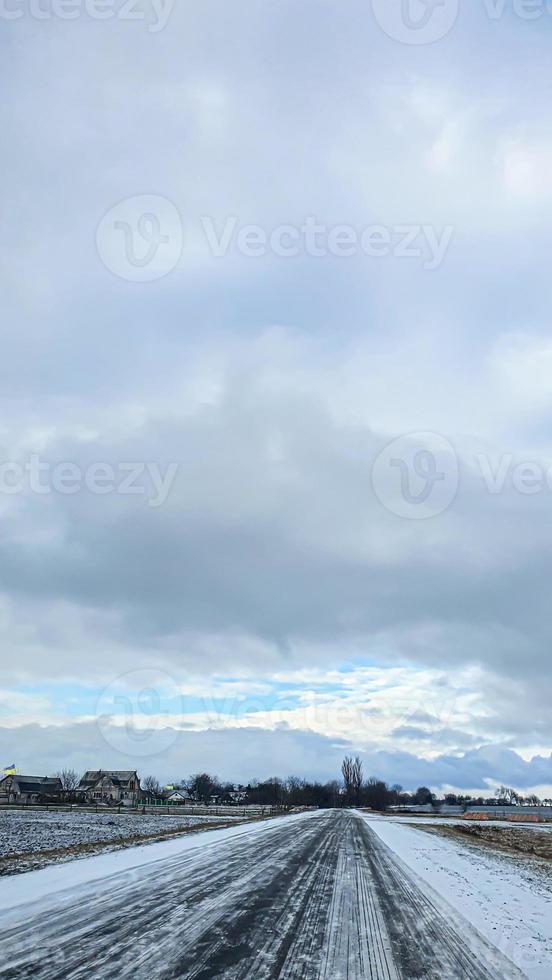 Blue sky with clouds. Road, exit from the occupied territories. War in Ukraine. Escape from the aggressor. photo