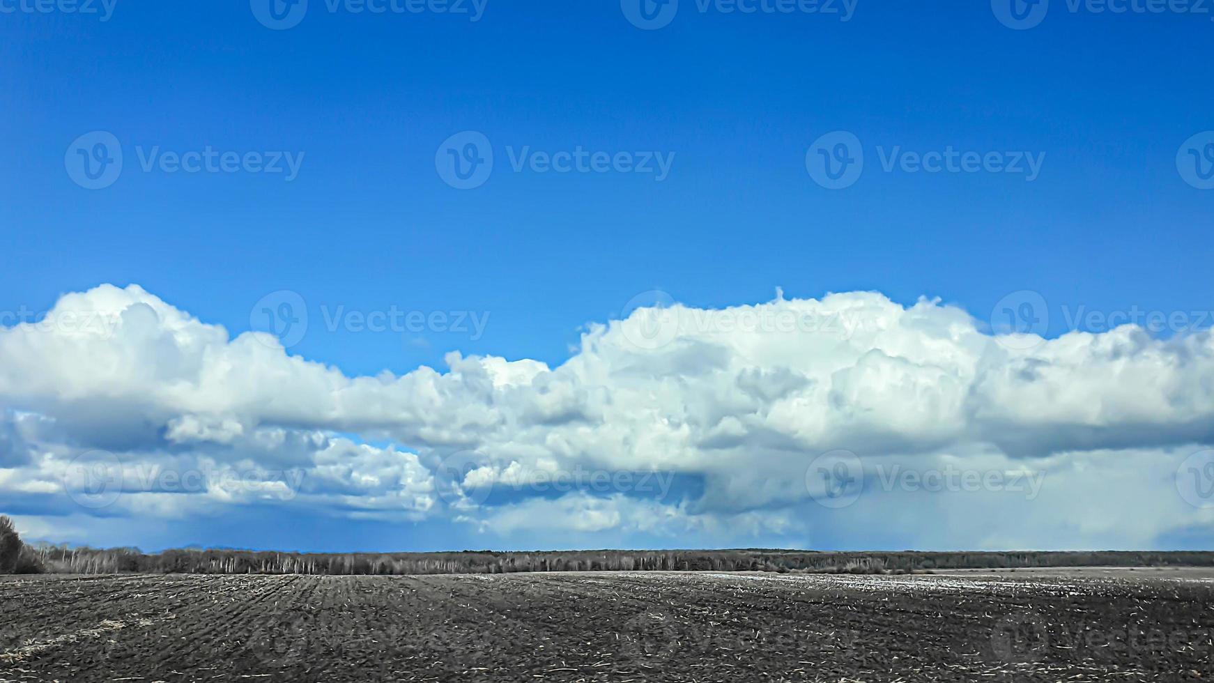 Sowing time in Ukraine during the war. Preparing fields for sowing grain. Blue sky, plowed land. terror. photo