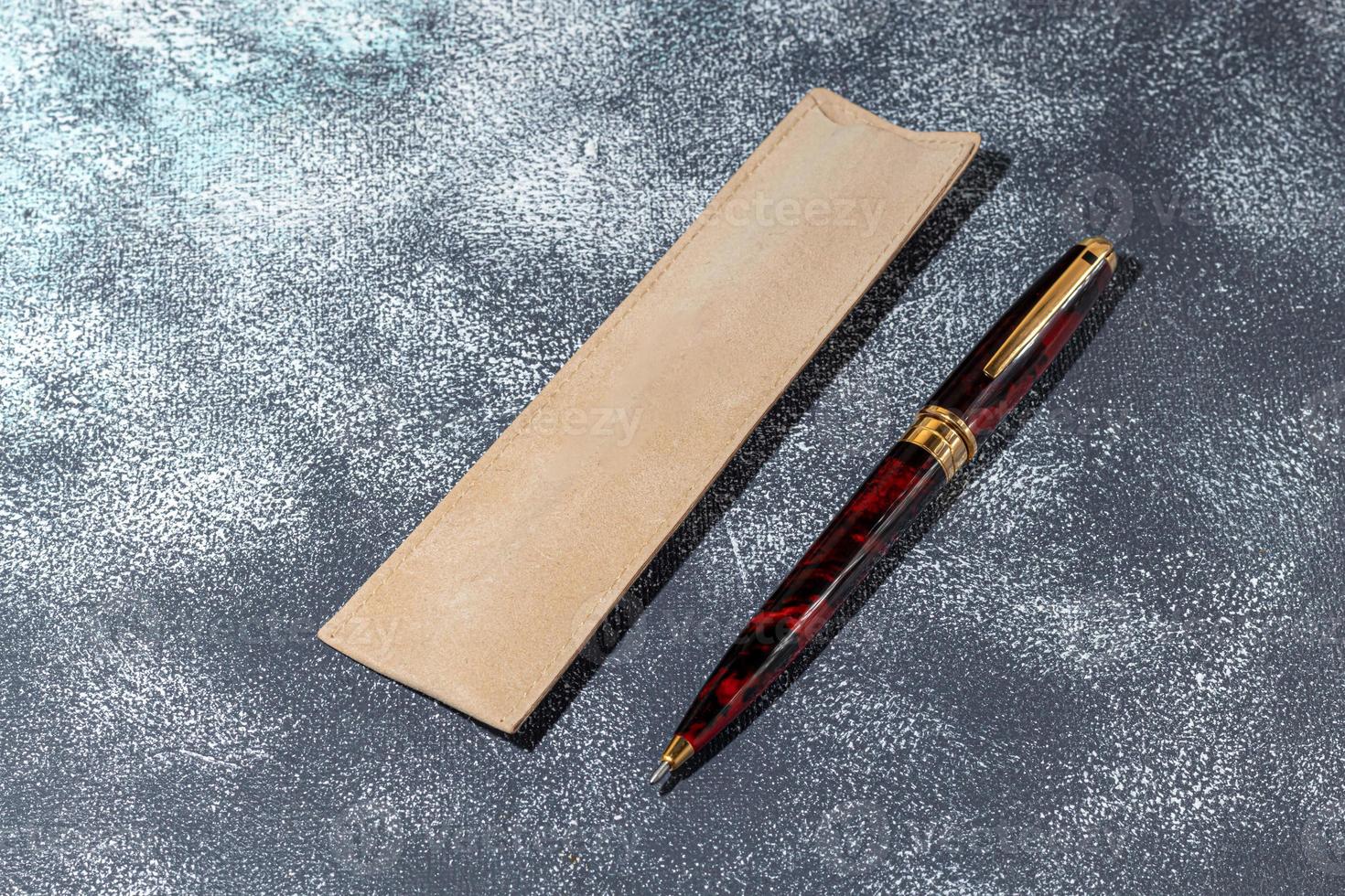 Fountain pen on a marble and gray background. Selective focus. photo