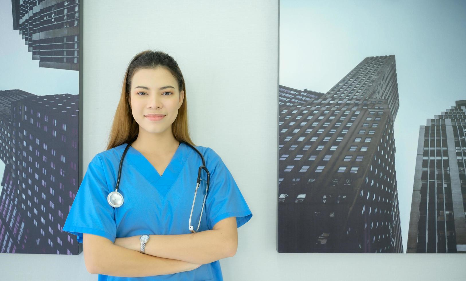 A doctor with a stethoscope used for initial diagnosis working at a hospital photo