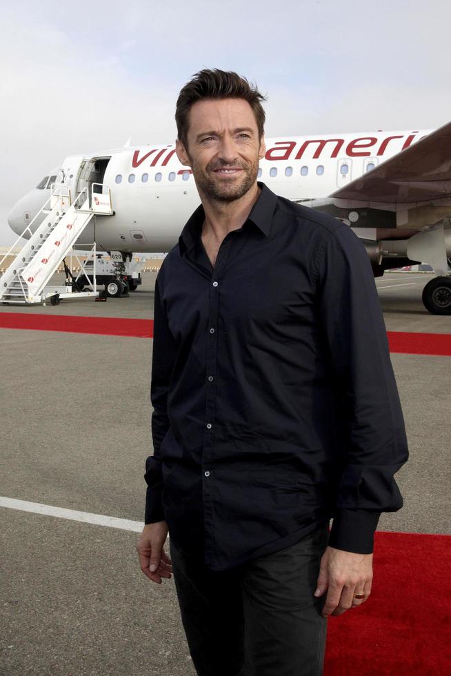 LOS ANGELES, SEPT 23 -  Hugh Jackman arrives as Virgin America unveils new DreamWorks  Reel Steel  plane at LAX Airport on September 23, 2011 in Los Angeles, CA photo